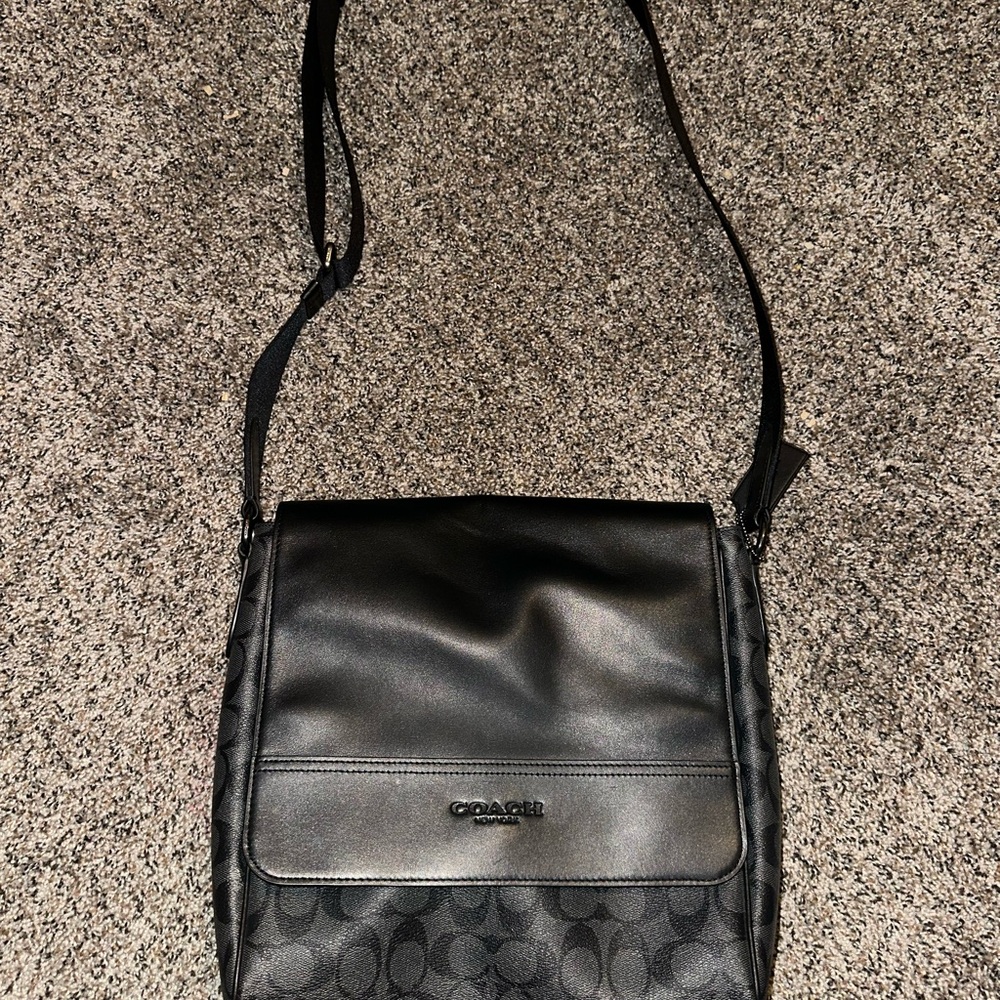 Coach Black Messenger Bag with Flap Closure and Adjustable Strap